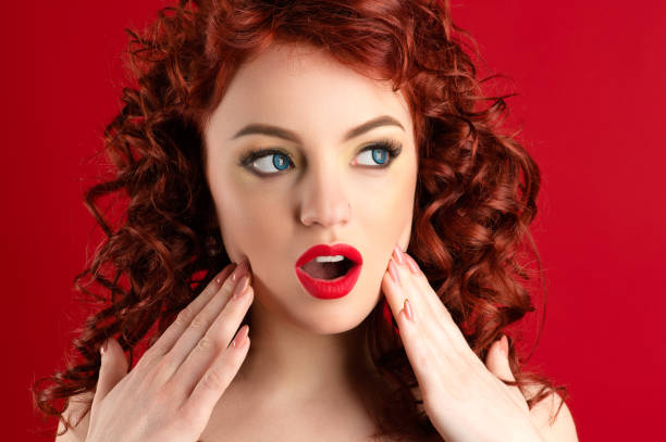 istock beautiful surprised woman with bright makeup and curls 1142889414