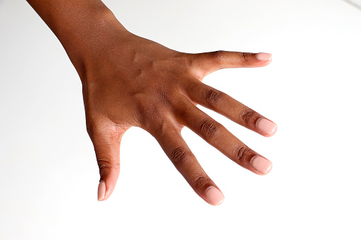 isolated photo of a black african female hand to be used for skin care layouts