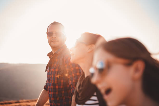 istock Men hiking with friends on a mountain 1142890686