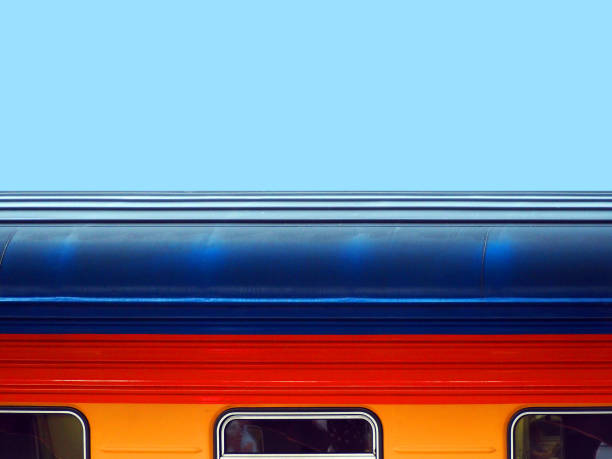 istock Passenger railway car on blue sky background. Colorful train car 1142890846