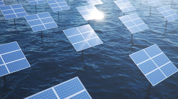 3D illustration solar panels in the sea or ocean. Alternative energy. Concept of renewable energy. Ecological, clean energy. Solar panels, photovoltaic with reflection beautiful blue sky. stock photo