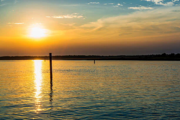 istock summer sunset over Bibione lagoon water, Italy 1142894007