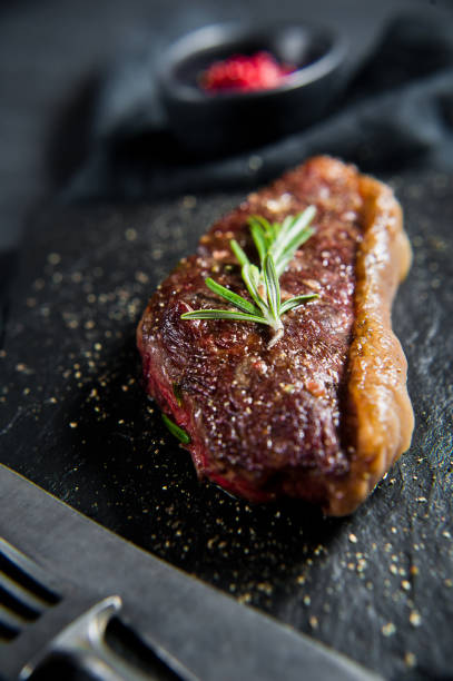istock Beef ramp steak with rosemary. Black background, top view. 1142894880