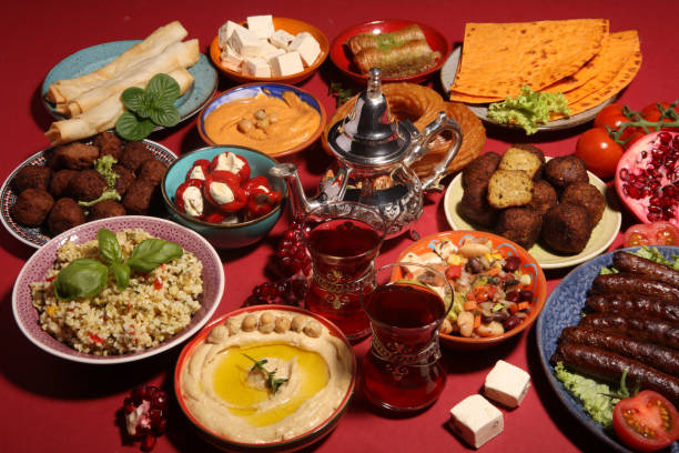 istock Middle eastern or arabic dishes and assorted meze, concrete rustic background. Falafel. Turkish Dessert Baklava with pistachio. Halal food. Lebanese cuisine 1142894895