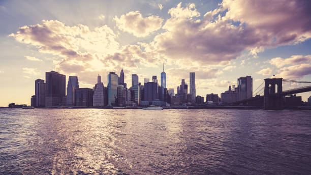 istock Manhattan skyline silhouette at sunset, NYC. 1142896557