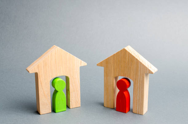 istock Two neighbors. Good neighborhood, district. Communication, communication between two people and houses. Houses in the village. Two wooden houses with neighbors. 1142898120