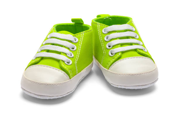 istock Pair Green Baby Shoes 1142899100