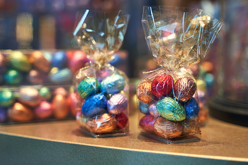 Colorful Easter chocolate eggs in a confectionery storefront in Brussels, Belgium