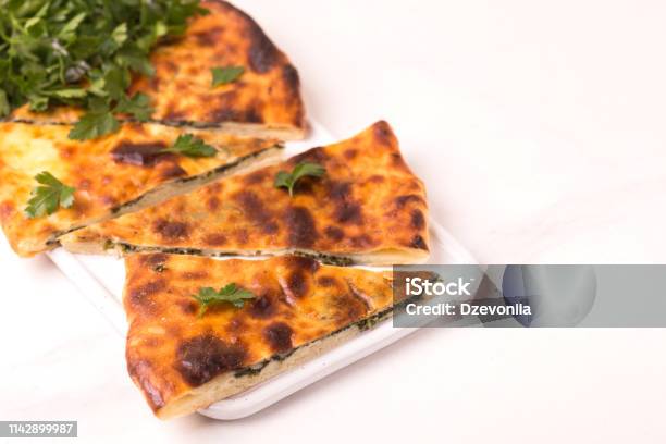 Khachapuri Megrelian With Spinach And Parsley Pita Bread With Cheese Stock Photo - Download Image Now