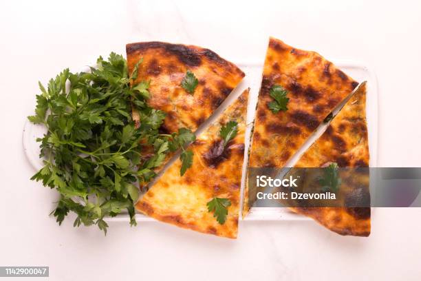 Khachapuri Megrelian With Spinach And Parsley Pita Bread With Cheese Stock Photo - Download Image Now