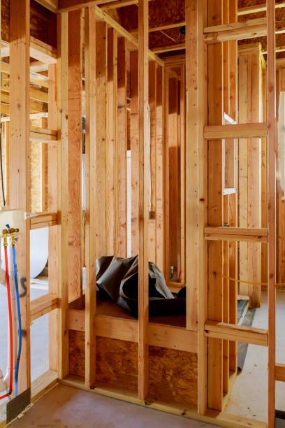 istock Home Framing unfinished wood frame building or a house 1142903085