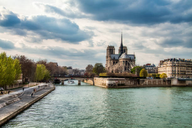 istock Notre Dame Cathedral during a Cloudy day with Seine River in Foreground, Paris 1142905399