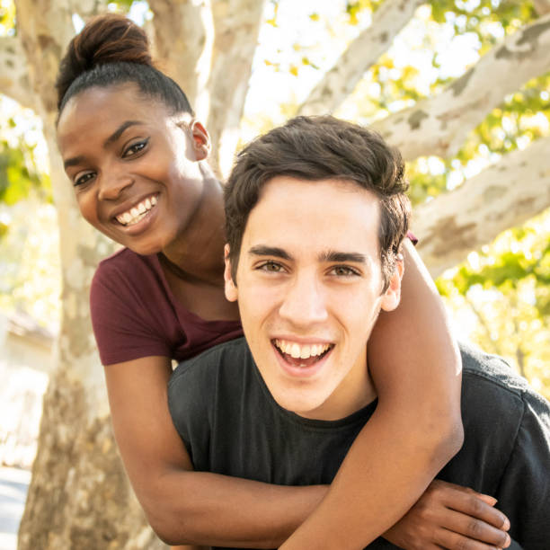 istock Young mixed race couple posing together smiling 1142905677