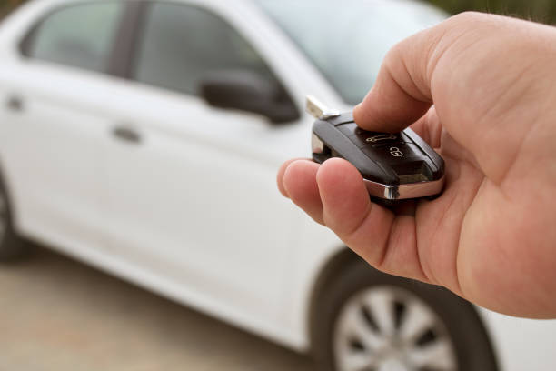 istock Men's hand presses on the remote control car alarm systems 1142906989
