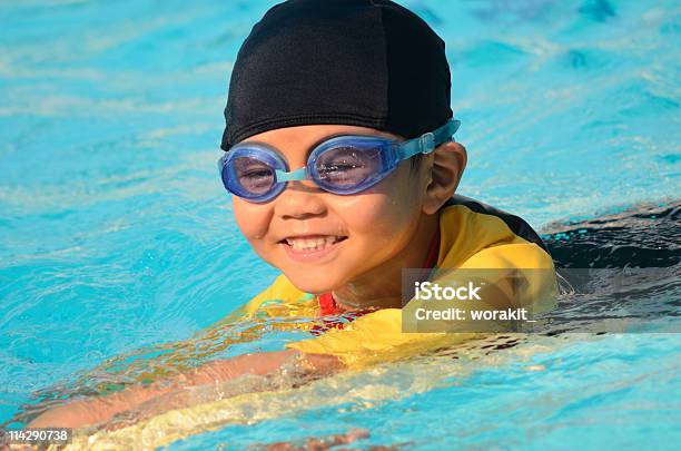 Little Boy Practice Swimming Stock Photo - Download Image Now - Activity, Blue, Boys