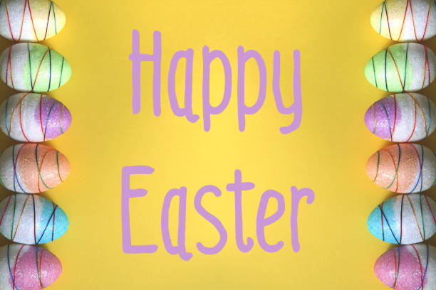 easter eggs on yellow background. - easter text single word paint imagens e fotografias de stock