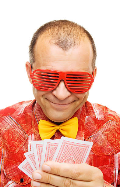 istock Gambler holding playing cards and smiling 114291379