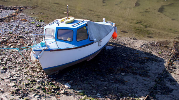 Older boats moored in the riverside