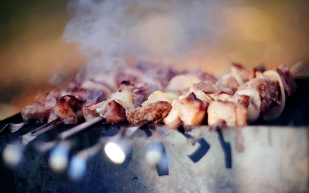 istock Smoky grilling the marinated pork meat shashlik. 1142918158