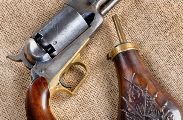 istock Antique Pistol and Powder Flask. 1142921480