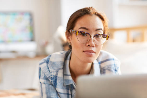 istock Beautiful Asian Woman Working from Home 1142921550