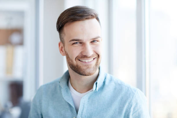 istock Portrait of Handsome Man by Window 1142921768