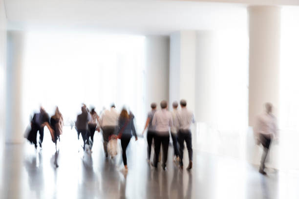istock Motion Blurred Group of Business People 1142922703