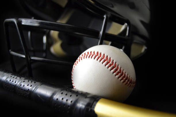 istock Baseball, Batting Helmet, and Baseball Bat with Black background 1142925369