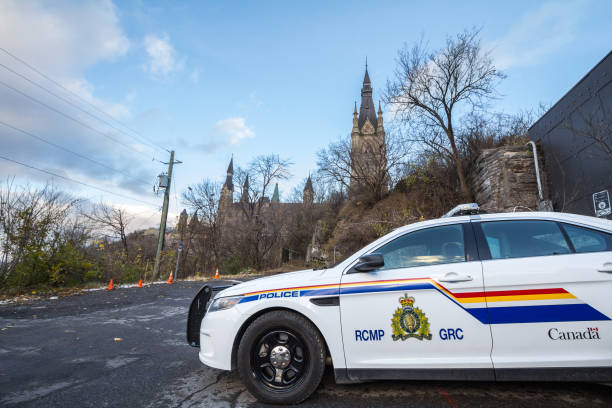 RCMP GRC Police car standing in front of the Canadian Parliament Building. The Royal Canadian Mounted Police is the Federal police of Canada stock photo