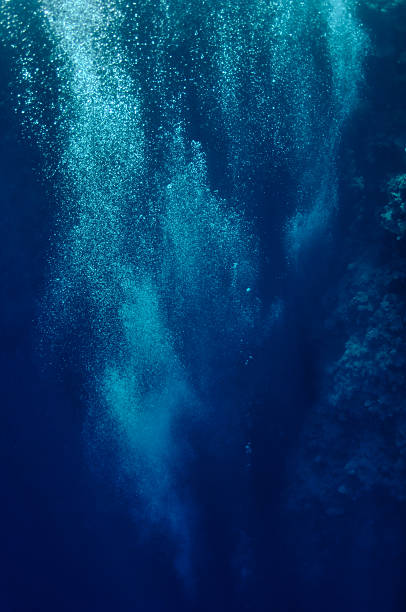 istock Raising underwater bubbles in the blue sea 114292806
