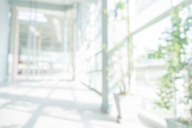 istock Abstract blurred white doctor medical office room background concept for blur empty space grey modern hospital clinic pharmacy, light clean interior retail sale, blue glare window hallway building 1142928491