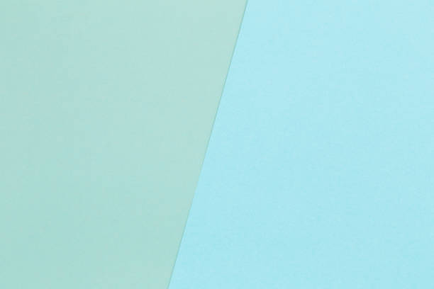 istock geometric blue and green paper background 1142929641