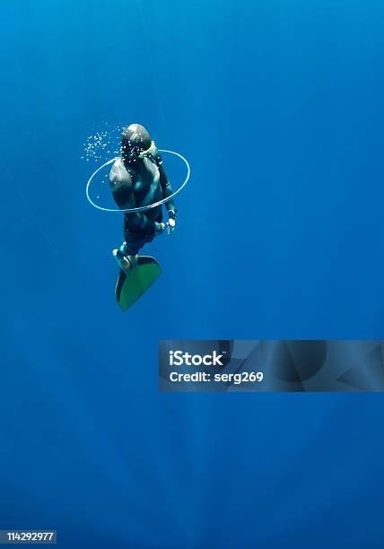 Freediver Tries To Swim Through The Bubble Air Ring Stock Photo - Download Image Now