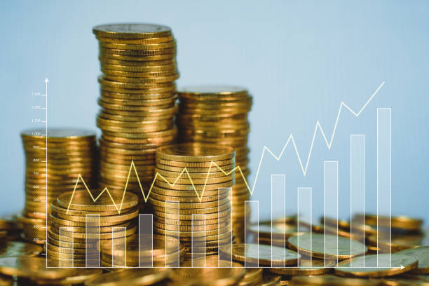 istock Double exposure Stack of coin with financial graph over city and office building background, business and financial concept. 1142929874