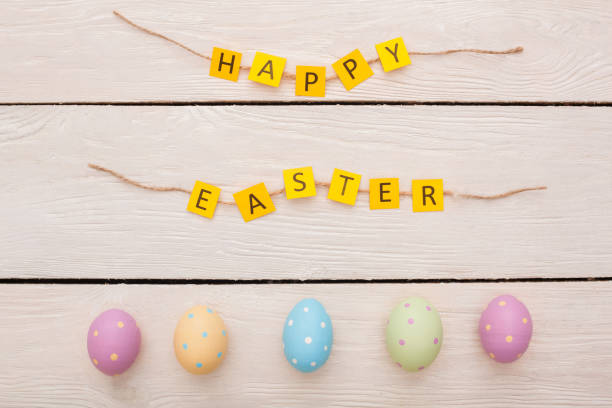 istock Easter traditional objects isolated on wooden background happy easter congratulations and eggs 1142929950