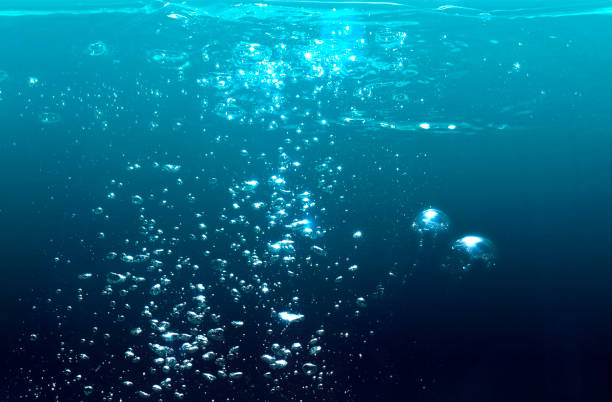 istock under water in deep sea with air bubbles water. 1142937478