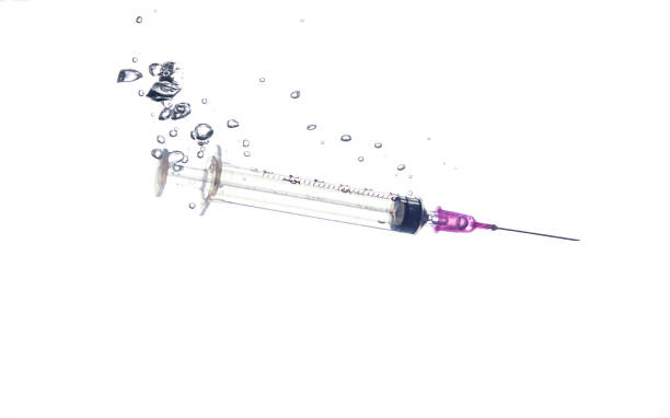 istock sterilization of syringe isolated on white background. 1142938009