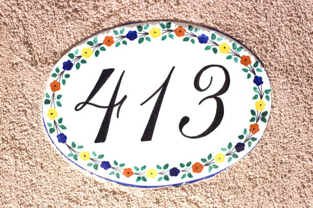 istock Ceramic Number 413 Street Address Tile; Orange Wall 1142938235