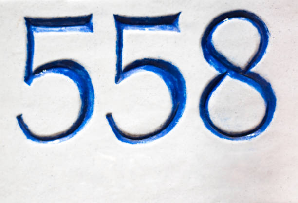 istock Ceramic Number 558 Street Address Tile; Orange Wall 1142938344