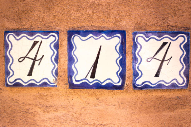 istock Ceramic Number 414 Street Address Tile; Orange Wall 1142938860