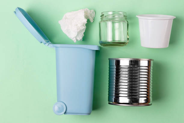 istock Trash can and plastic, iron garbage on green background, top view. 1142942838