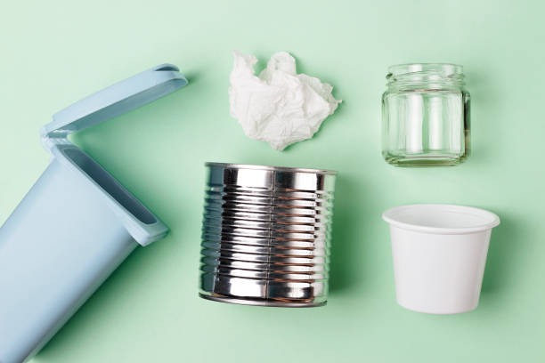 istock Trash can and plastic, iron garbage on green background, top view. 1142942839