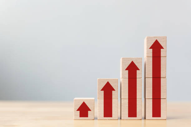 istock Ladder career path for business growth success process concept.Wood block stacking as step stair with arrow up 1142945247