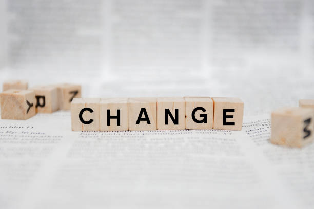 istock Change Word Written In Wooden Cube - Newspaper 1142949010