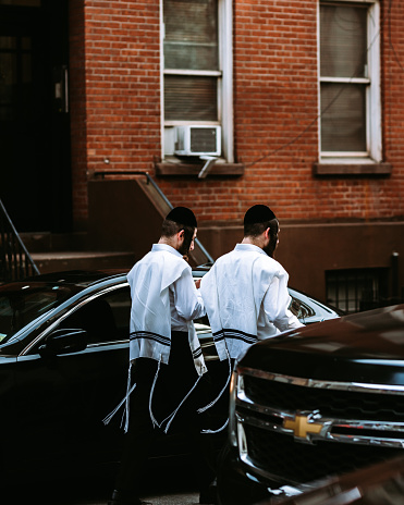 New York City, United States - April 13, 2019 - Orthodox Jews walking the streets of Chelsea near Chelsea Market in Manhattan.