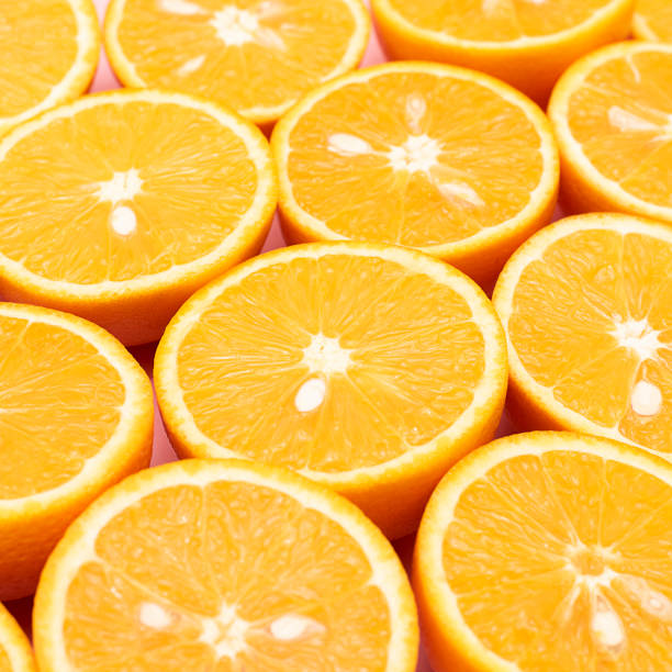 istock Orange juicy oranges are divided in half 1142954241