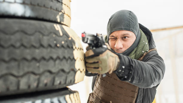 istock Combat gun shooting training behind and around cover or barricade 1142958054