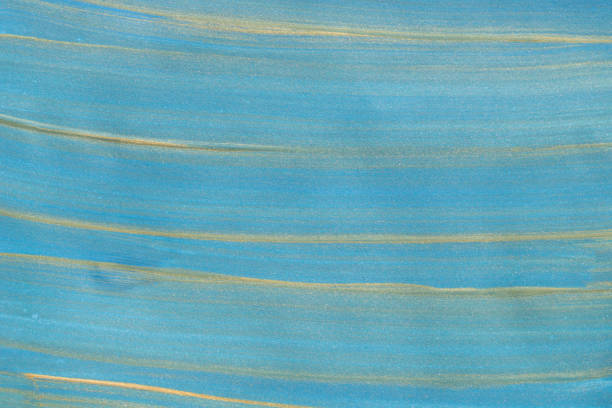 istock blue and gold painted on paper background texture 1142958118