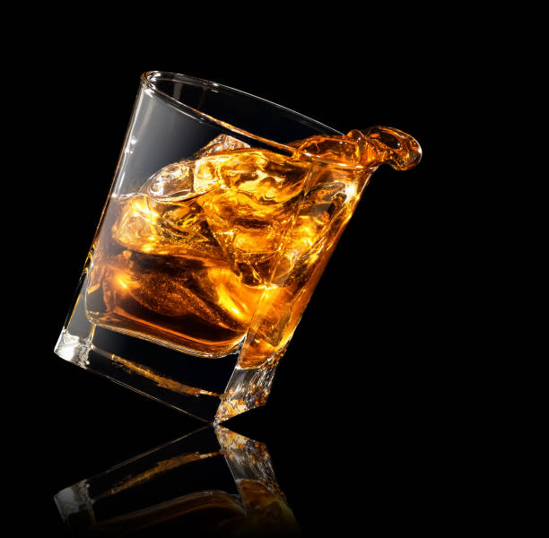 istock splash of whiskey in glass 1142962401