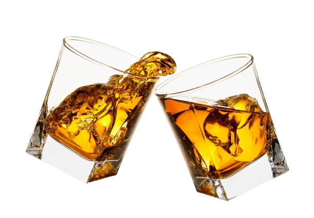 istock glasses of whiskey making toast 1142962402